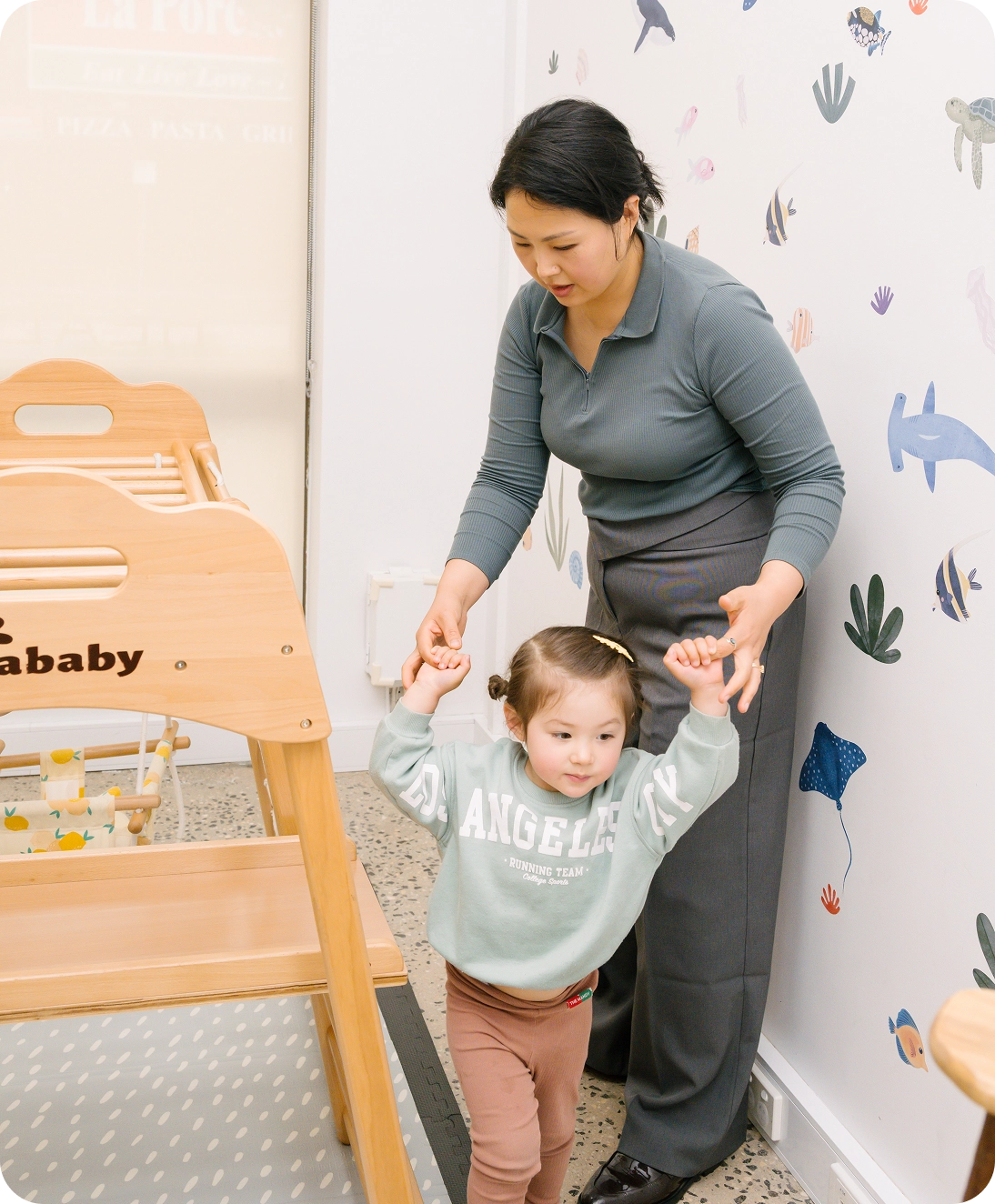 Woman playing with toddler